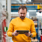 A person examining a tablet screen