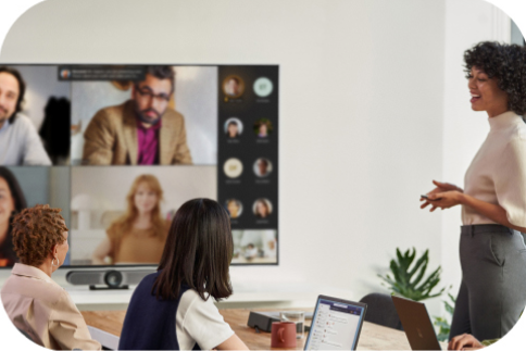 Person presenting to a conference room live and over Teams.