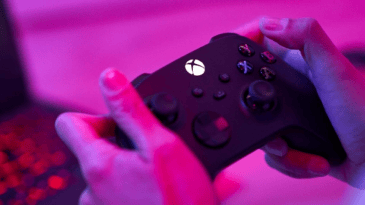 Hands holding an Xbox controller