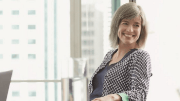 A person smiling in an office