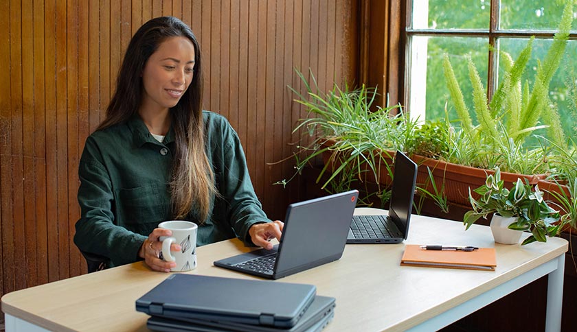 An associate working in an architectural design firm in front of laptop