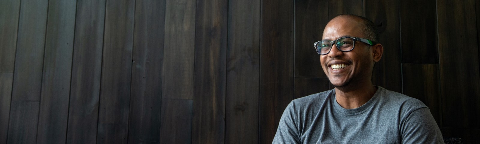 Professional wearing glasses and smiling