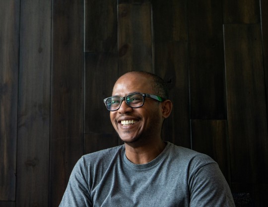 Professional wearing glasses and smiling