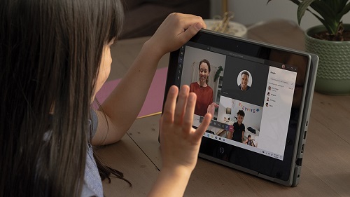A child having conversation using Teams video call in her tablet