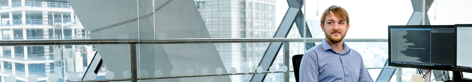 An IT professional works in an office