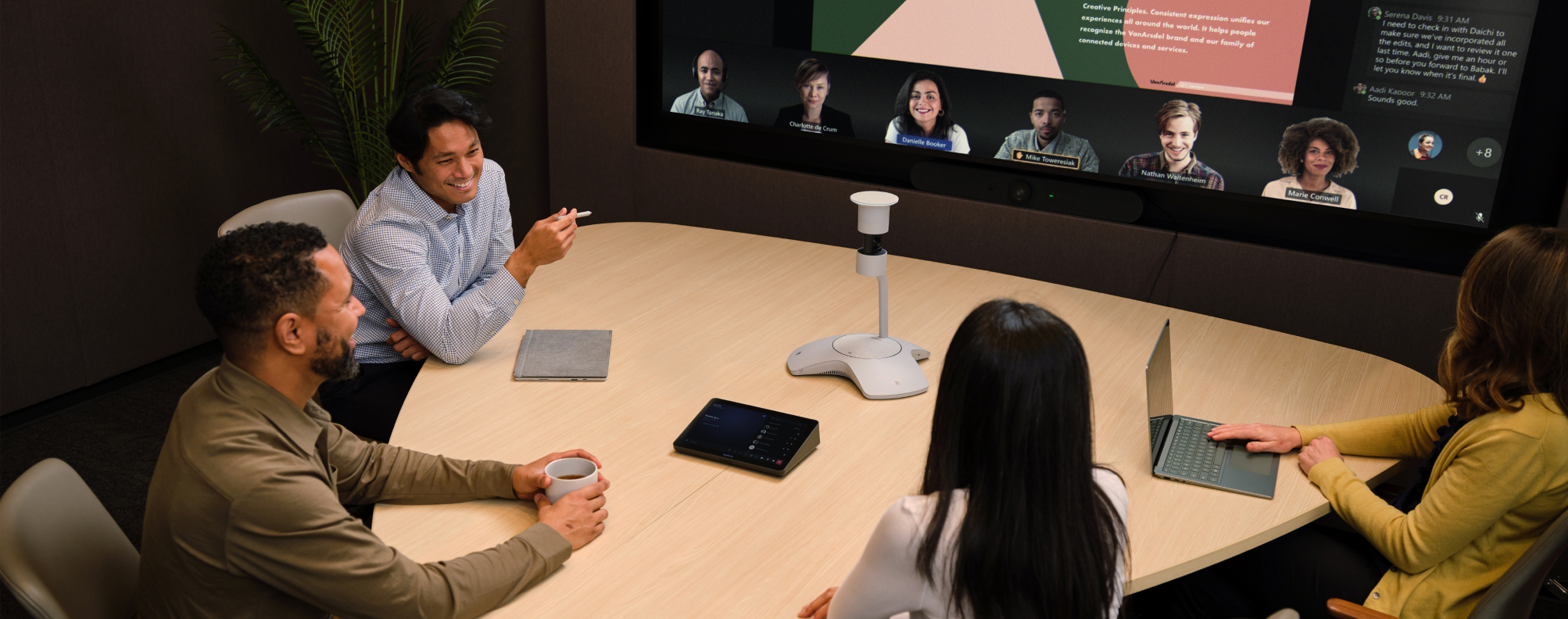 People in a conference room watching a presentation.