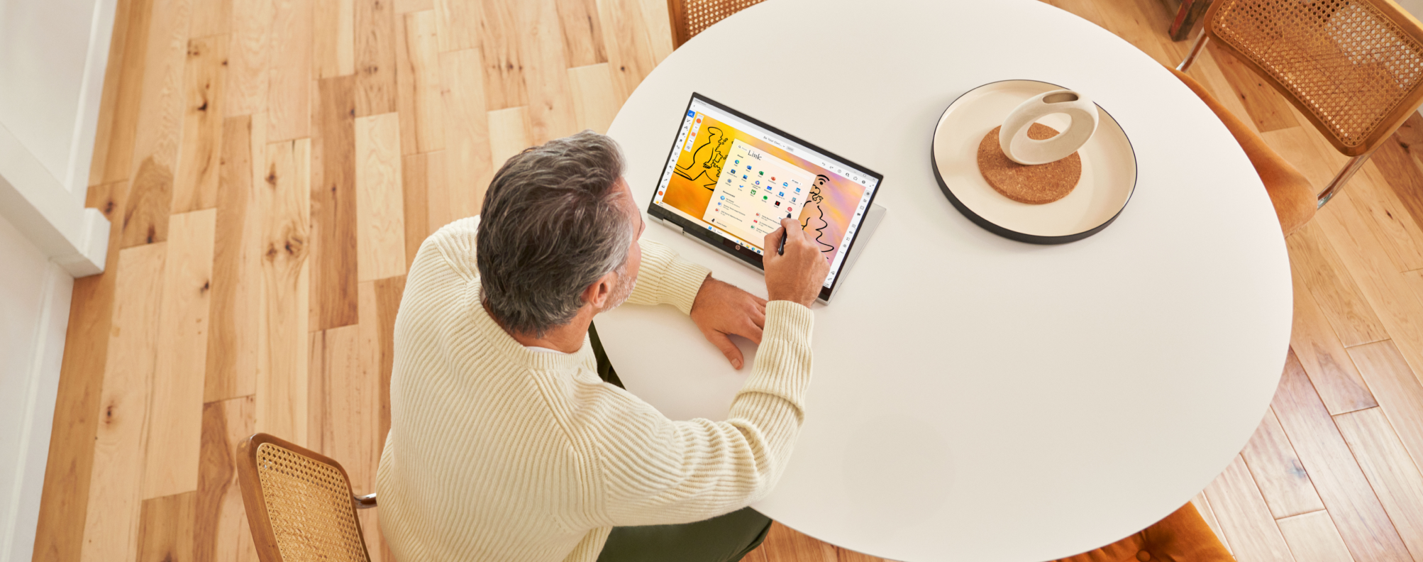 overhead view of a person using a tablet computer