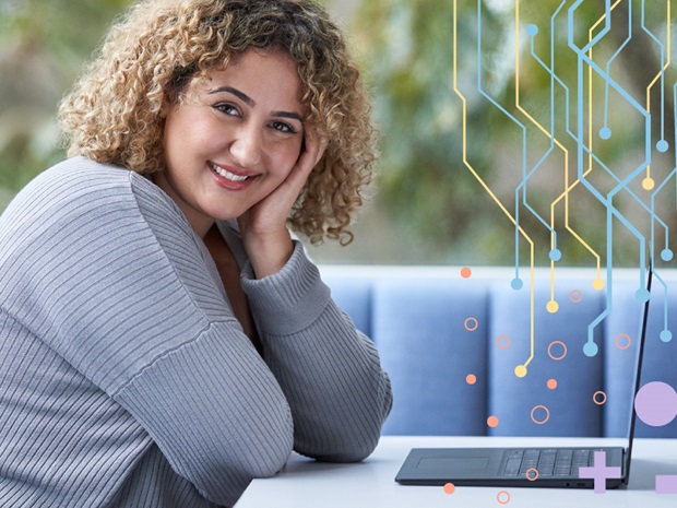 Woman sitting at booth with open laptop and smiling at the camera. Image has graphic overlay of a circuitry design.