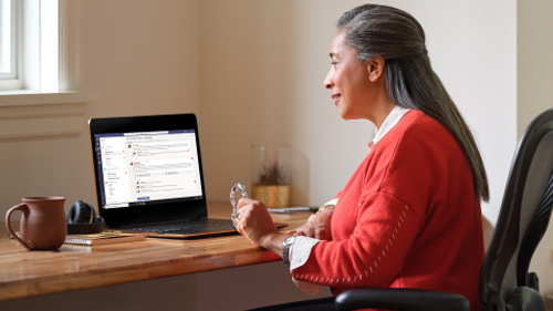 elder woman working on laptop