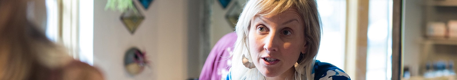 A retail worker answers a question