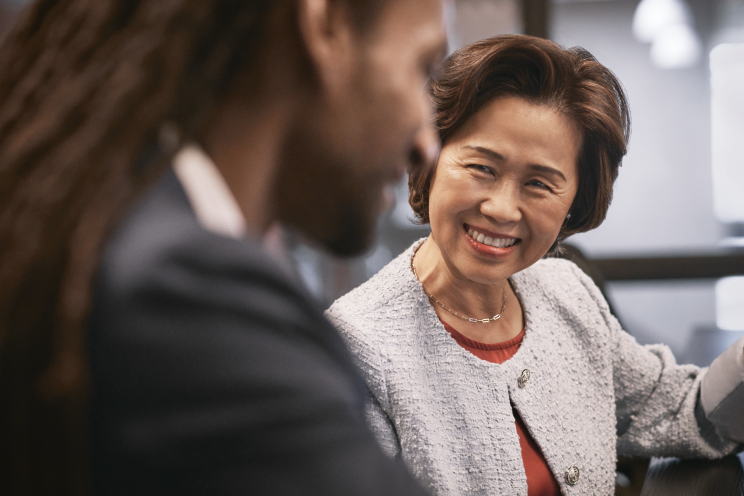 Person smiling at another person.