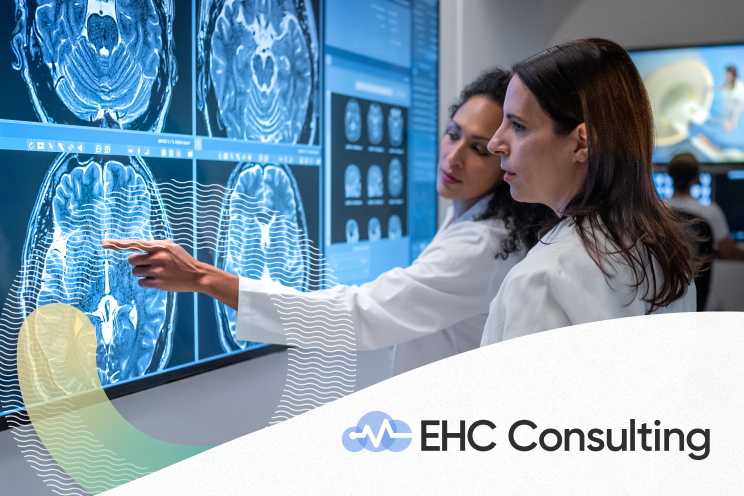 Two people looking at a medical scan of a brain.