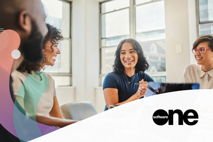 People around a table smiling and talking