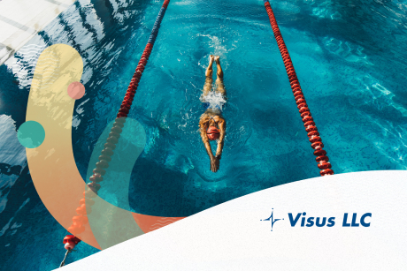 A person swims in the lane of an indoor pool