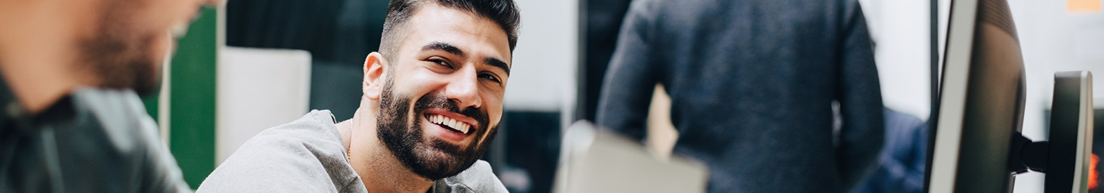 Business colleagues laughing during meeting