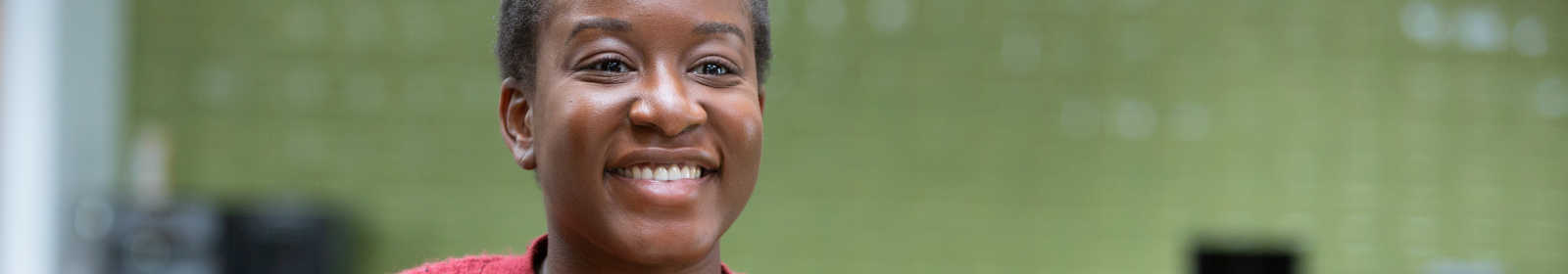 Woman with a facemask in hand