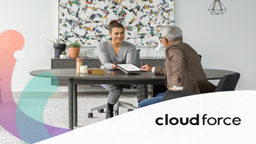 Two people sitting across from each other at a table.