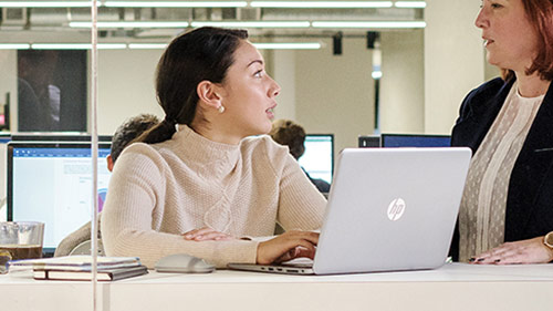 women talking in office