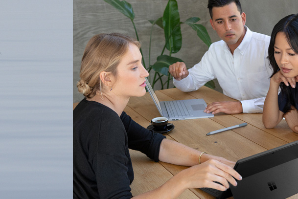 Three coworkers collaborating in a meeting 