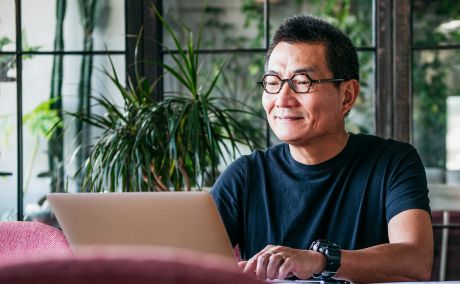 A person working on a laptop.