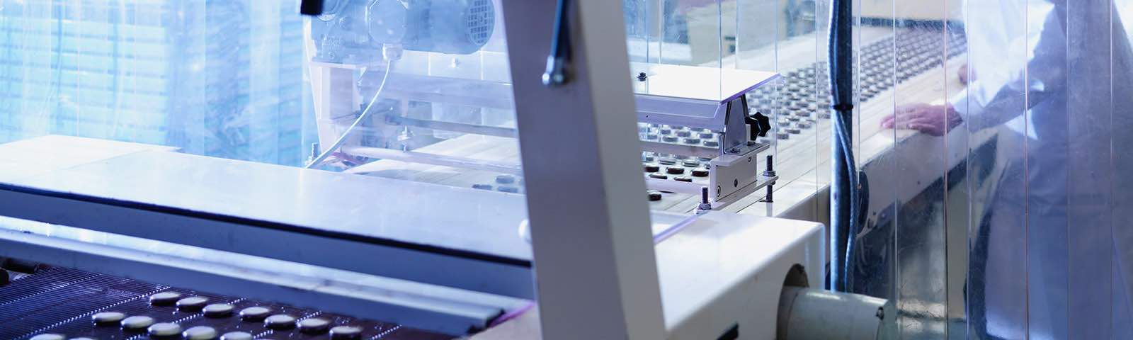 Picture of a person working at an assembly line