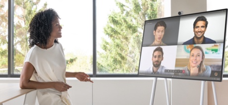 Woman talking to a Surface Hub on a video call