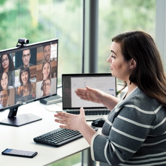 Woman at a desk talking on a video call