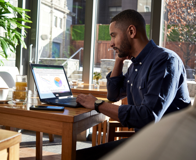 Person working on a laptop in a home office