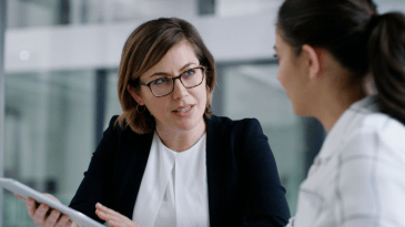 Woman talking to a colleague