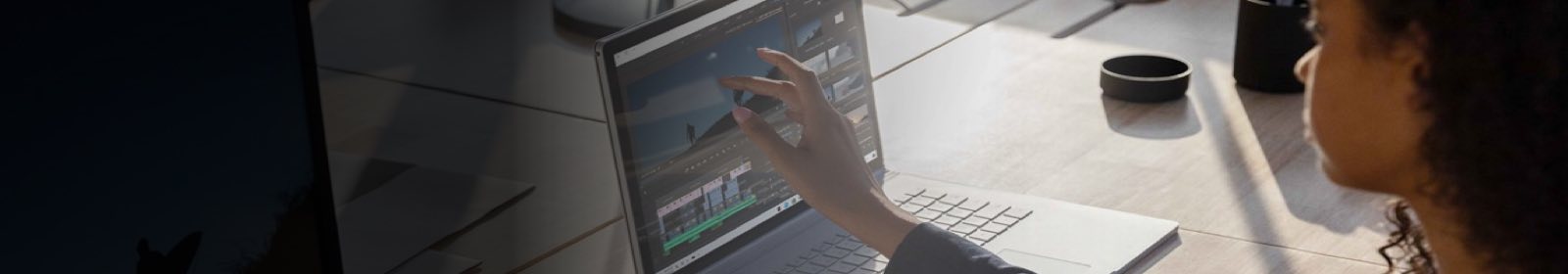 Person touching a laptop touch screen