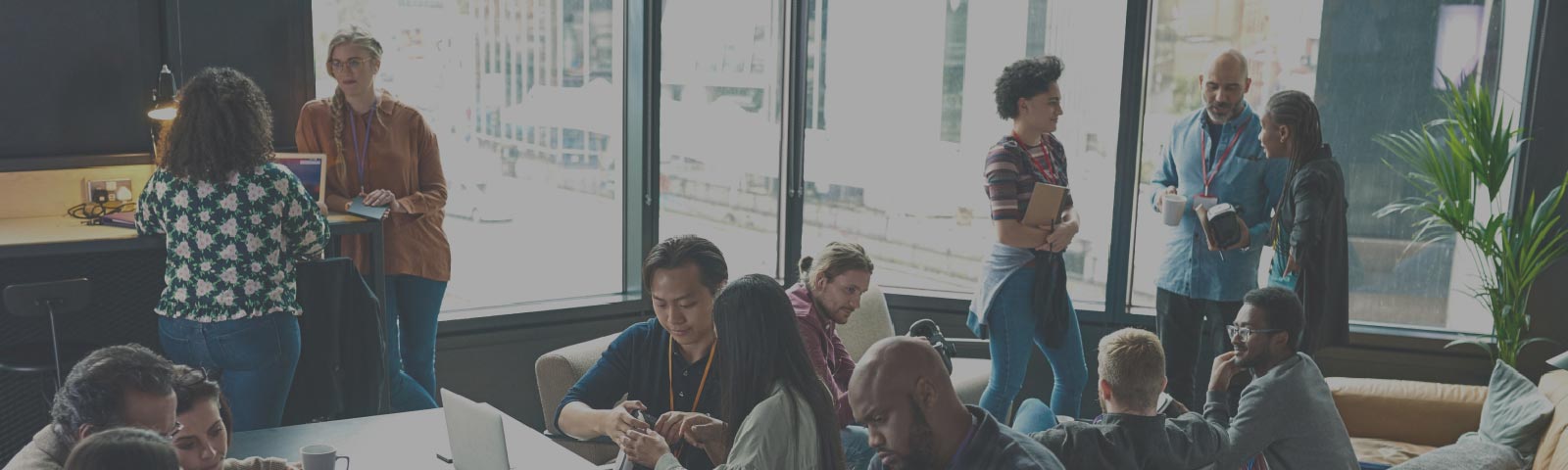 Large diverse group of people working in a modern office