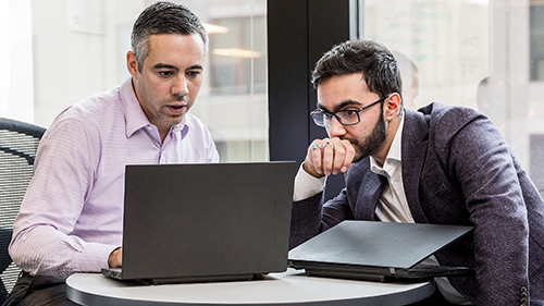 Two men sitting at table
