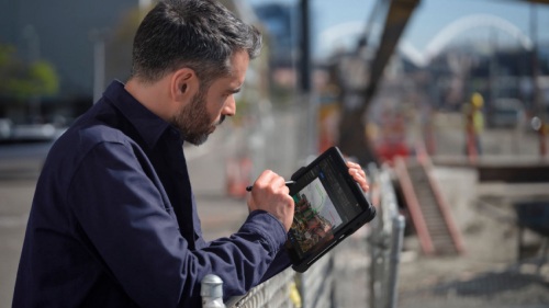 A person looking at the Surface device