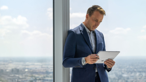 A person looking at the Surface device