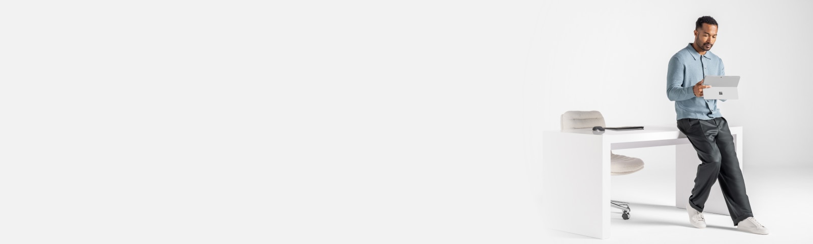 A person looking at the Surface device