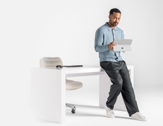 A person looking at the Surface device